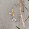 Bracelet libellule en acier inoxydable bicolore orné de strass