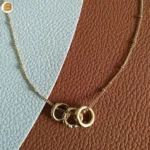 Collier femme acier inoxydable doré pendentifs anneaux oxyde de zirconium