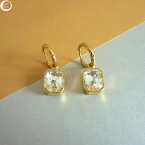 Boucle d'oreilles créoles acier doré et leurs pendants en cristal blanc