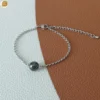 Bracelet acier mixte avec une perle ronde en hématite