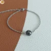Bracelet acier mixte avec une perle ronde en hématite
