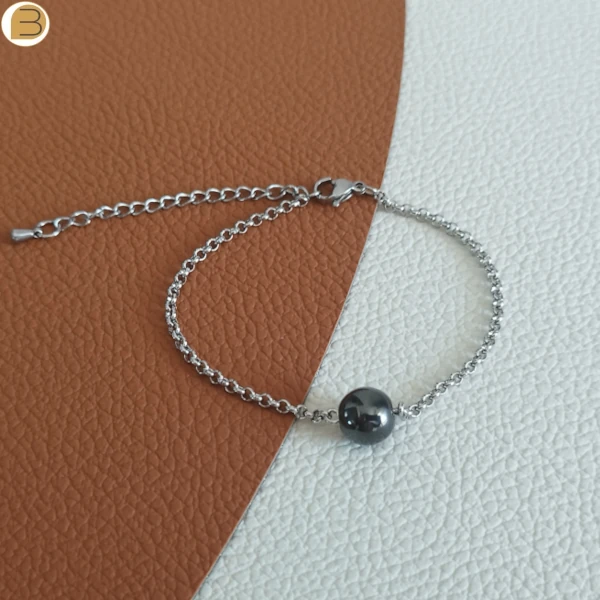 Bracelet acier mixte avec une perle ronde en hématite