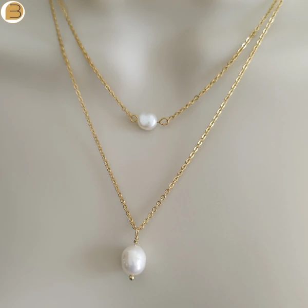 Création Bijoutissimo collier pour femme en acier doré double chaine perles d'eau douce