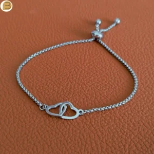 Bracelet réglable pour femme en acier avec ses cœurs entrelacés Création bijoutissimo