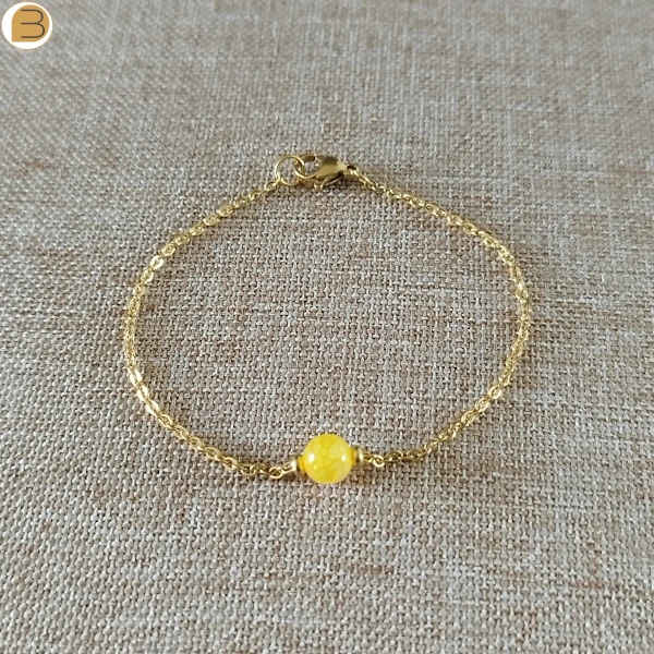 Bracelet acier doré avec sa perle ronde en citrine et ses perles acier