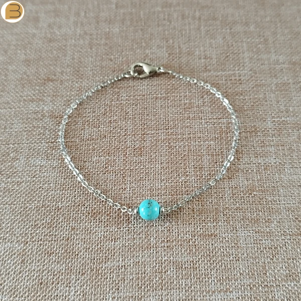 Bracelet acier avec une perle ronde en turquoise